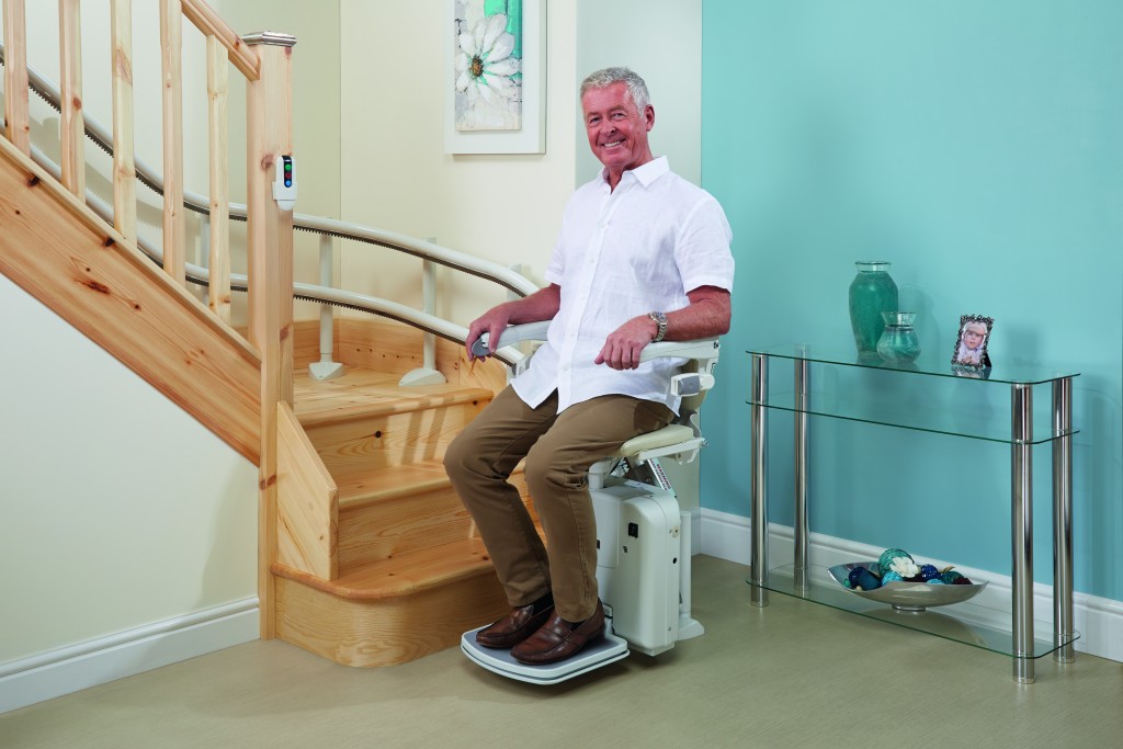 A curved stairlift installed on a staircase